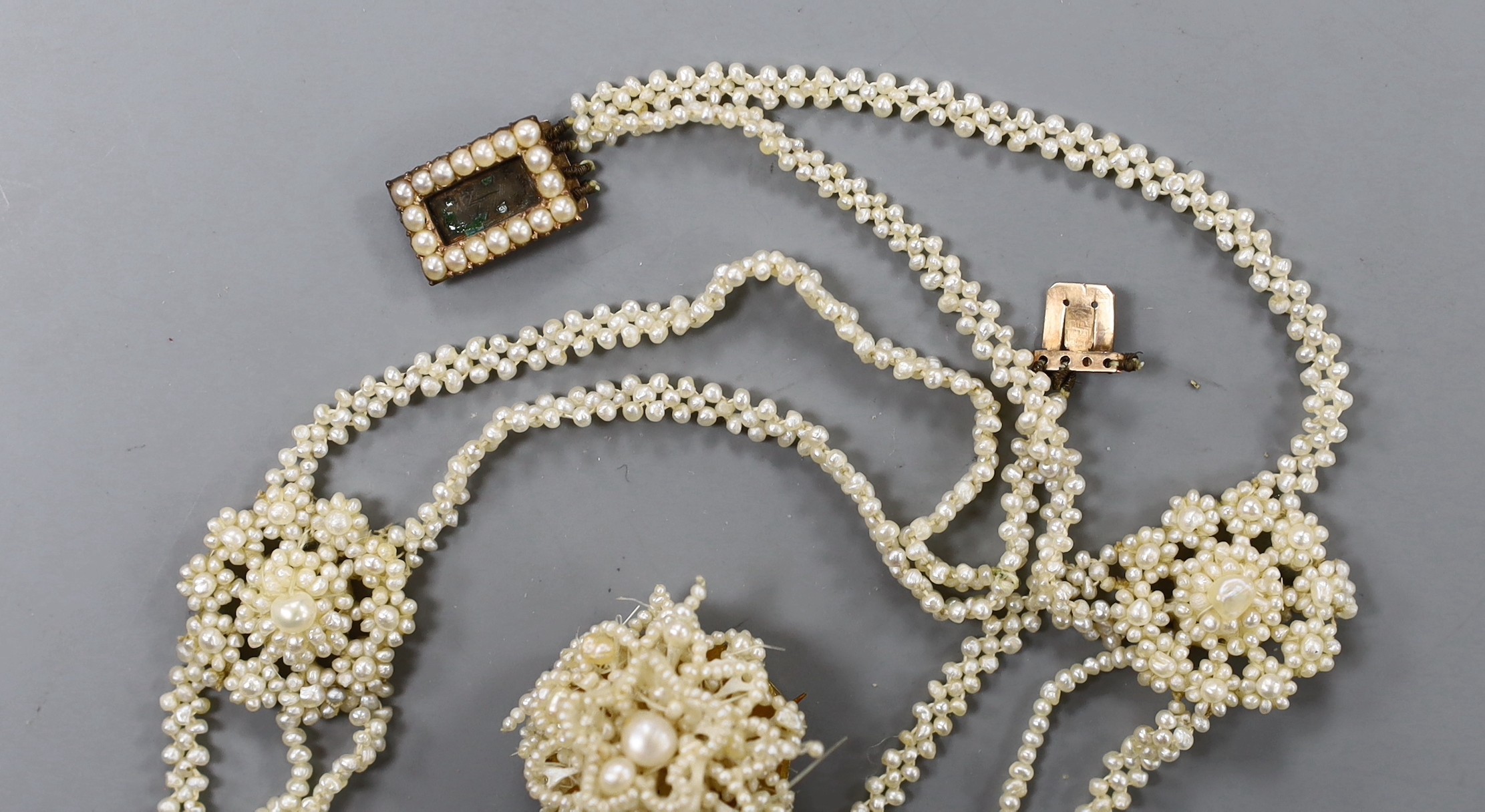 A 19th century seed pearl cluster set necklace, with yellow metal clasp, 32cm and a similar brooch.